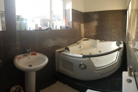 A bright and spacious bathroom with a modern co...