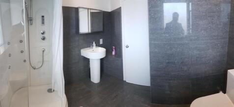 A modern, well-maintained bathroom featuring a ...