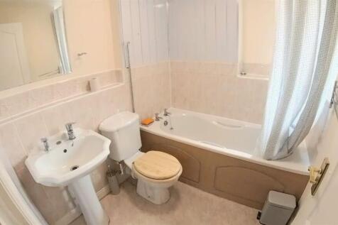 A clean and well-maintained bathroom featuring ...