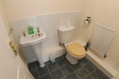 A clean and functional bathroom featuring a toi...