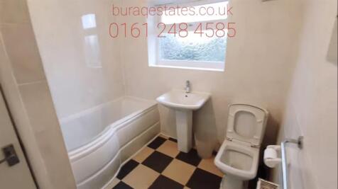 A bright, well-maintained bathroom featuring a ...