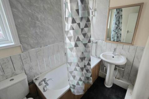 A clean and well-maintained bathroom featuring ...