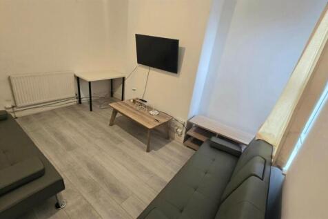 A well-maintained communal lounge featuring com...