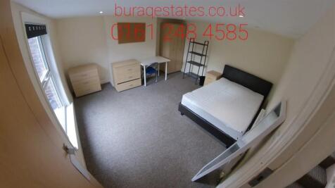 Bright and tidy double bedroom featuring a comf...