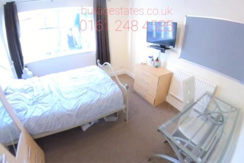 A bright and inviting double bedroom featuring ...