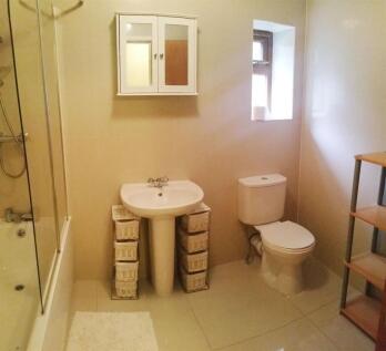 A clean and functional bathroom featuring a toi...