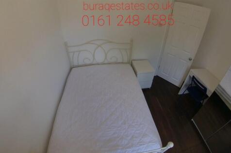 A tidy bedroom with a double bed, featuring a s...