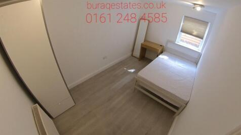 A clean, well-maintained small bathroom with ba...