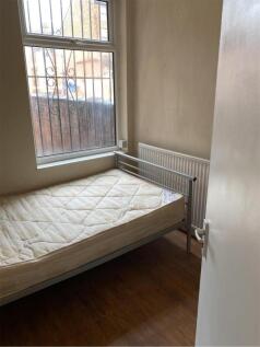 A small student accommodation room featuring a ...