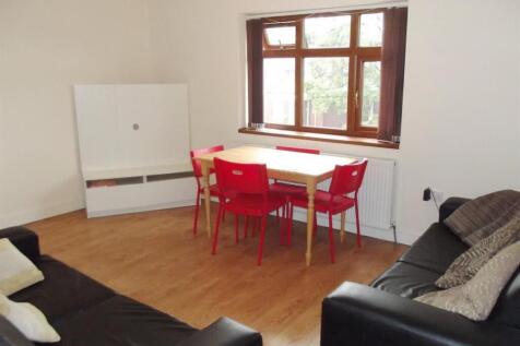 A bright and inviting living room with large wi...