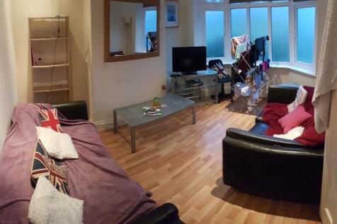 Spacious and welcoming living room featuring co...