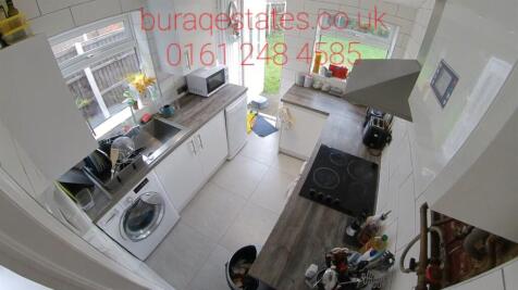 Bright and modern kitchen with ample natural li...