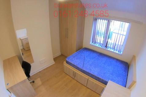 Bright and clean bedroom featuring a spacious d...