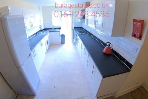 Bright and modern kitchen with ample counter sp...