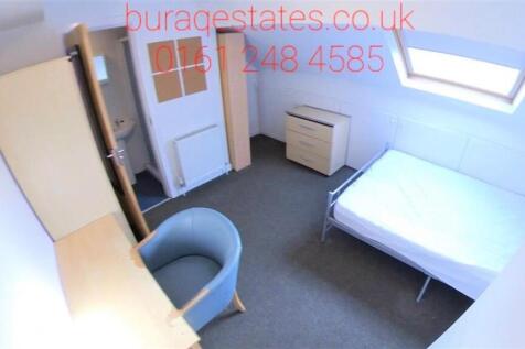 Bright and tidy single bedroom featuring a skyl...