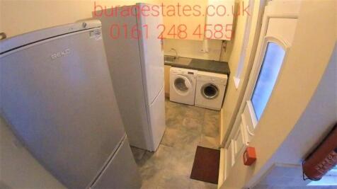 Compact and tidy storage area featuring a washi...