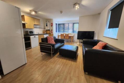 Bright and modern living room featuring comfort...