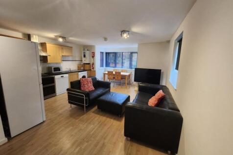 A spacious and inviting living room featuring m...