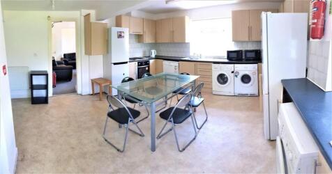 Bright and well-maintained kitchen area with am...