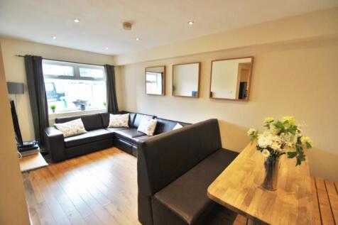 Bright and inviting living room featuring a lar...