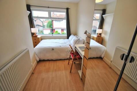 A bright and tidy double bedroom featuring a la...