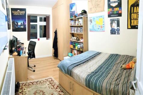 A well-maintained double bedroom featuring a la...