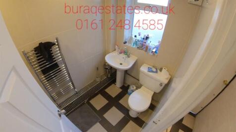 A well-maintained bathroom featuring a large si...