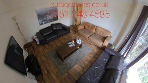 Bright and welcoming living room featuring thre...