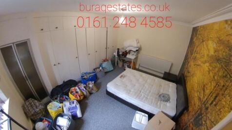 A spacious double bedroom featuring a large bui...
