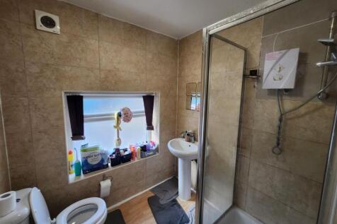 A well-maintained bathroom featuring a modern s...