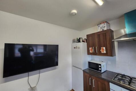 A well-maintained kitchen area featuring modern...