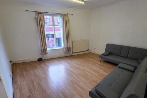 Bright and spacious living room featuring a com...