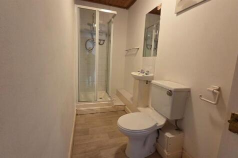 A clean and functional bathroom featuring a toi...