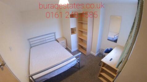 A neat and well-maintained double bedroom featu...