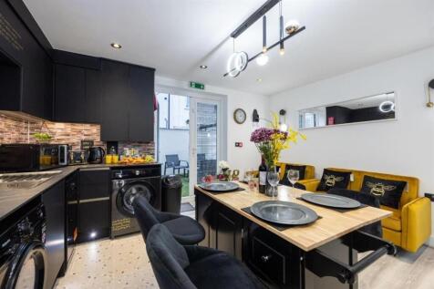 A modern, bright living room featuring stylish ...