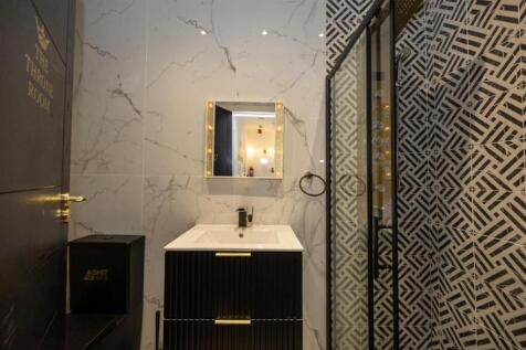 A clean and modern bathroom suite featuring a l...