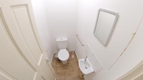 A clean, well-maintained bathroom with a toilet...