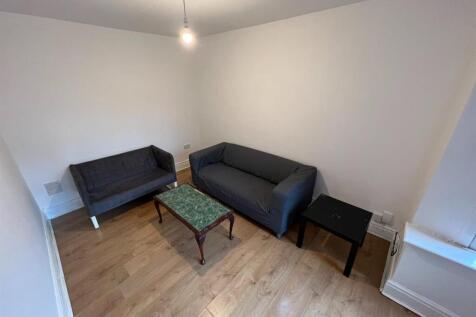 A modern and well-maintained living room featur...