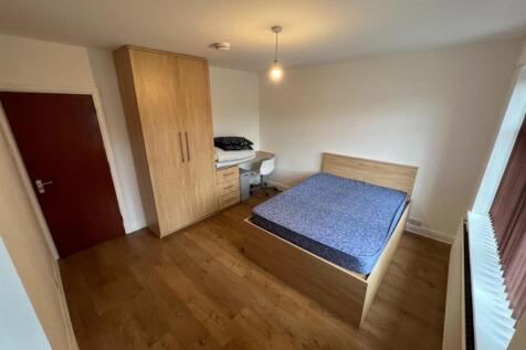 A modern double bedroom featuring a comfortable...