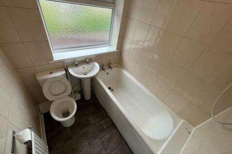 A clean and well-maintained bathroom featuring ...