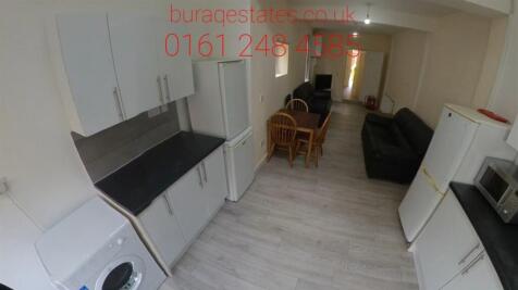 A bright and tidy kitchen space with modern app...