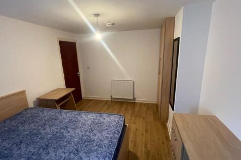 A clean and well-maintained bedroom featuring a...