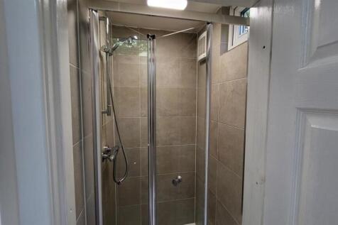 A clean and well-maintained bathroom with a lar...