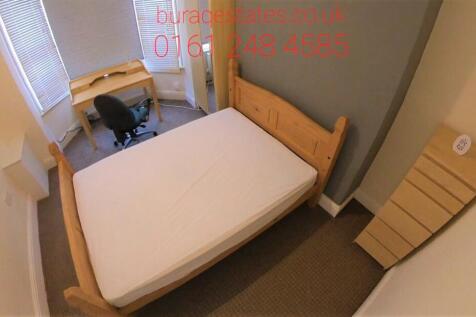 A compact, clean single toilet room with a simp...