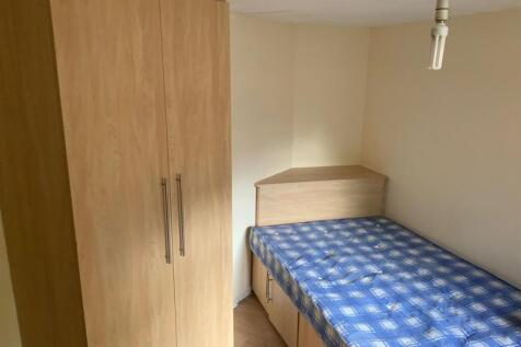 A neatly maintained bedroom featuring a double ...