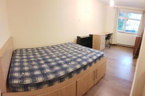 A comfortable double bedroom featuring a bed wi...