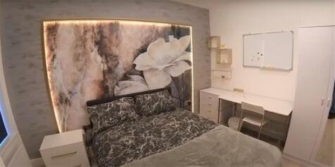 A spacious and well-maintained master bedroom f...