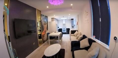 A modern, well-lit living room with contemporar...