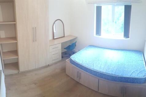 A bright and spacious master bedroom featuring ...