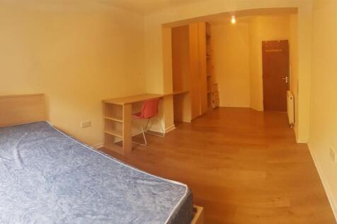 A well-maintained bedroom featuring a comfortab...